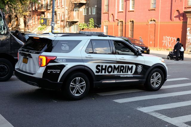 A shomrim vehicle patrols the streets in the Williamsburg neighborhood.